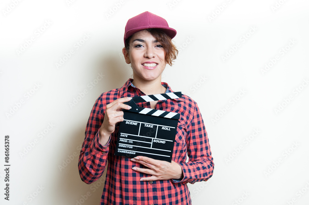 Smiling girl with movie clapper on white background