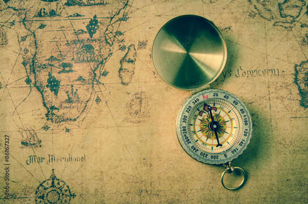 vintage compass on old map