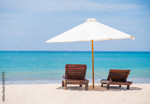 beds and umbrella on a beach