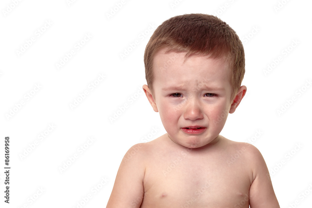 Portrait of a crying baby, looking forward with a tearful expres Portrait of a crying baby, looking forward with a tearful expres