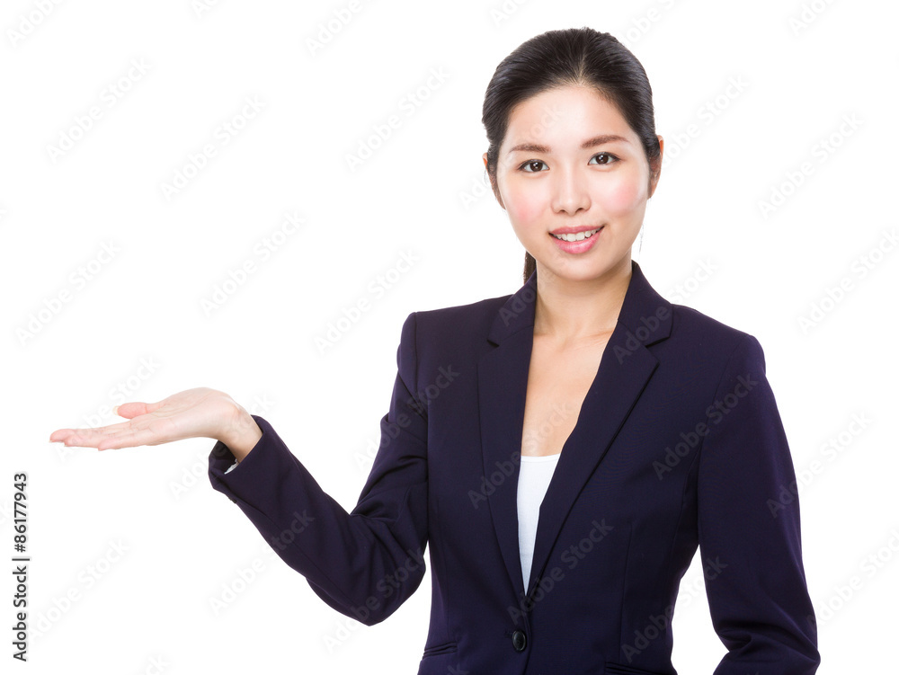 Asian businesswoman with hand presentation Asian businesswoman with hand presentation