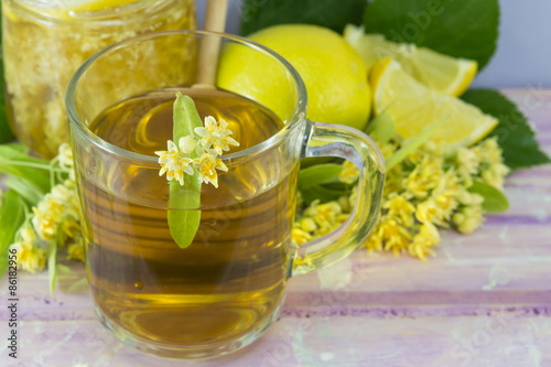 Linden tea with lemon decorated with lime flower