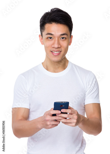 Asian young man use of the cellphone © leungchopan
