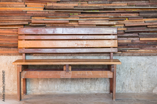 Vintage red chair with wood wall.