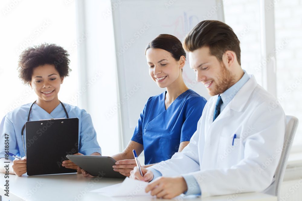group of happy doctors meeting at hospital office group of happy doctors meeting at hospital office