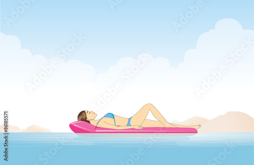 Women relaxing in the sea with resting on inflatable mattress