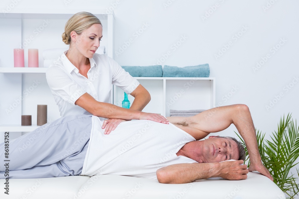 Doctor examining her patient back Doctor examining her patient back