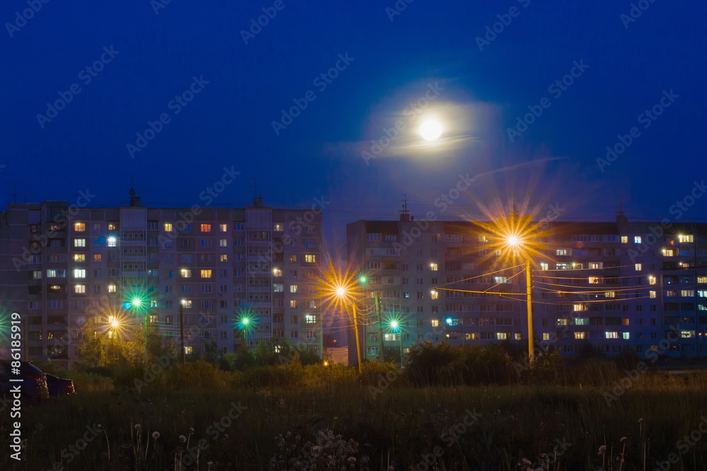 Night urban landscape with residential buildings