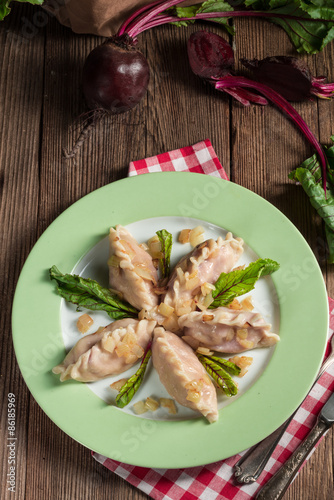 piquant pierogi with Beetroot and cheese filling photo