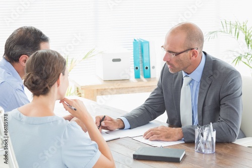 Photography Businessman explaining contract to business partners