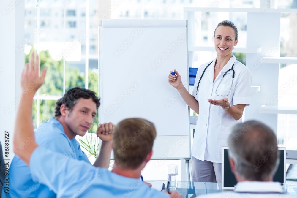 Team of doctors having brainstorming session Team of doctors having brainstorming session