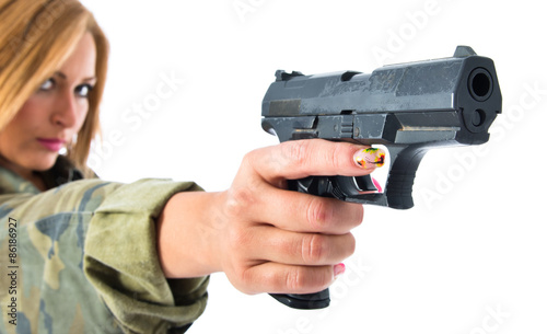 military woman shooting a gun