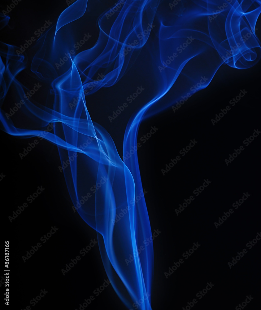 Fototapeta premium Blue smoke on black background