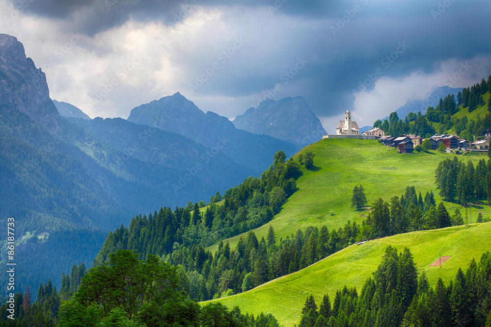 Church in Dolomites alps countryside meadow mountain
