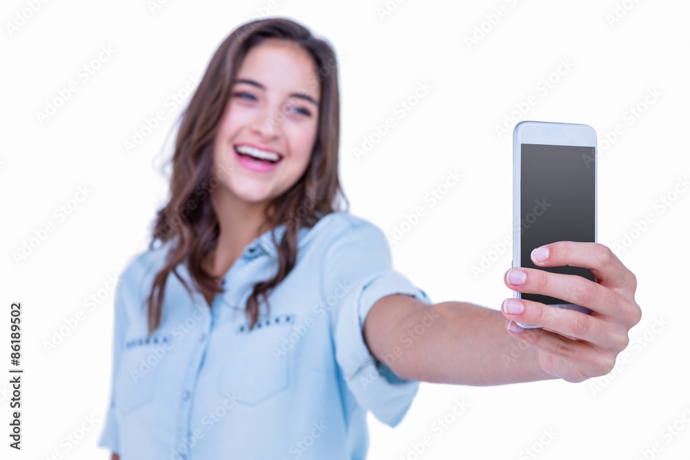 Pretty brunette taking a selfie with smartphone Pretty brunette taking a selfie with smartphone