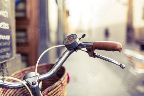 City bicycle handlebar and basket over blurred background #86189506