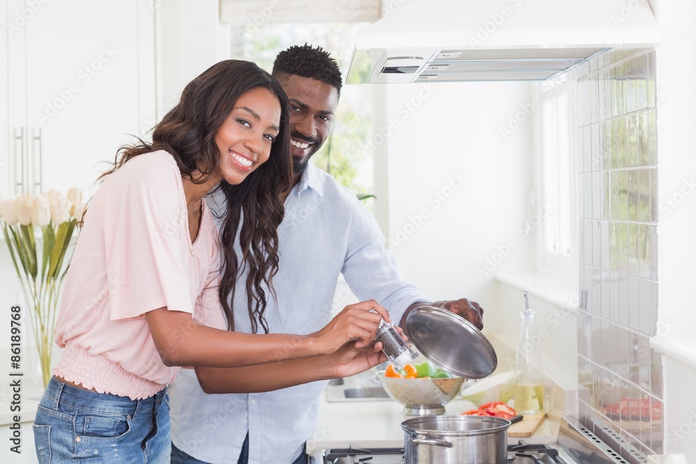 Happy couple cooking food together