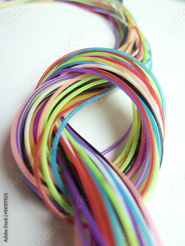 Background with a beautiful knot of multicolored strings