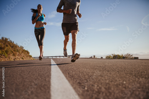 Runners training on country road