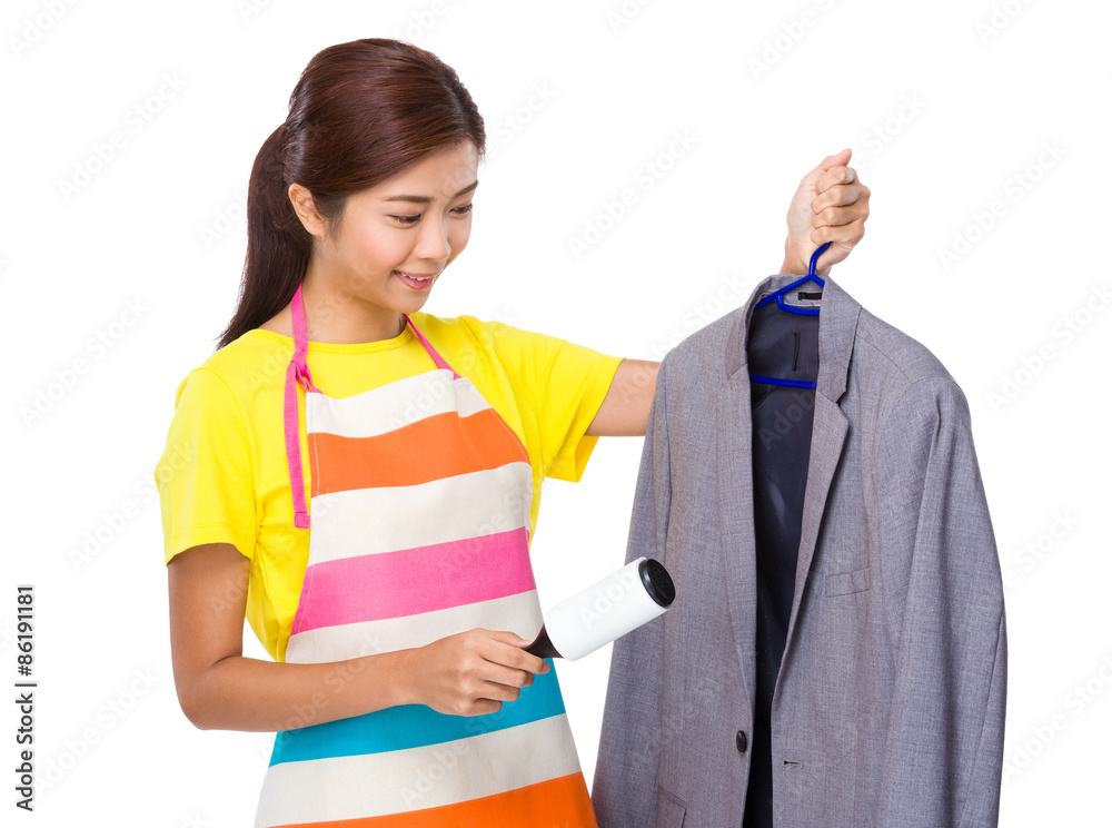 Young Housewife using the dust wheel in suit jacket Young Housewife using the dust wheel in suit jacket