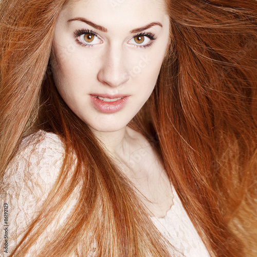 Portrait of amazinly beautiful young redhead woman