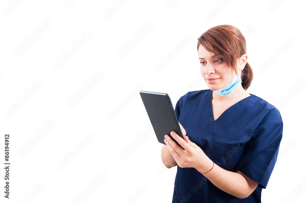 Woman doctor using tablet on white copyspace