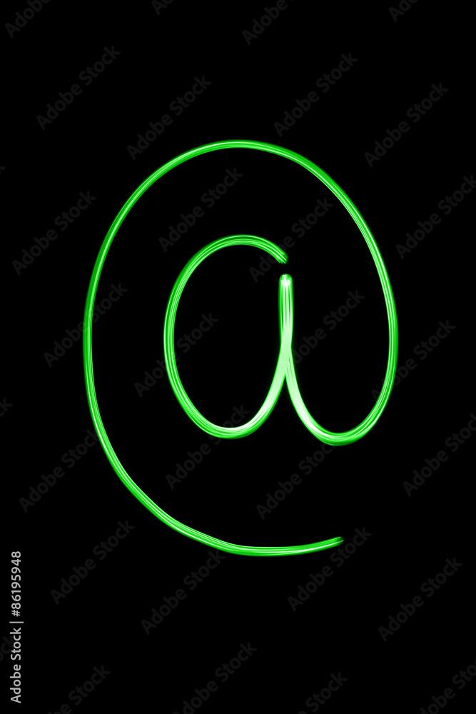 Flourescent letter '@' in bright neon green color Flourescent letter '@' in bright neon green color