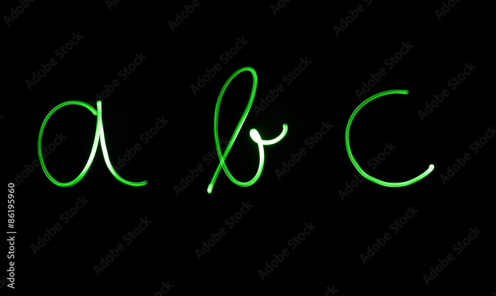 Obraz premium Flourescent letters 'abc' in bright green neon color
