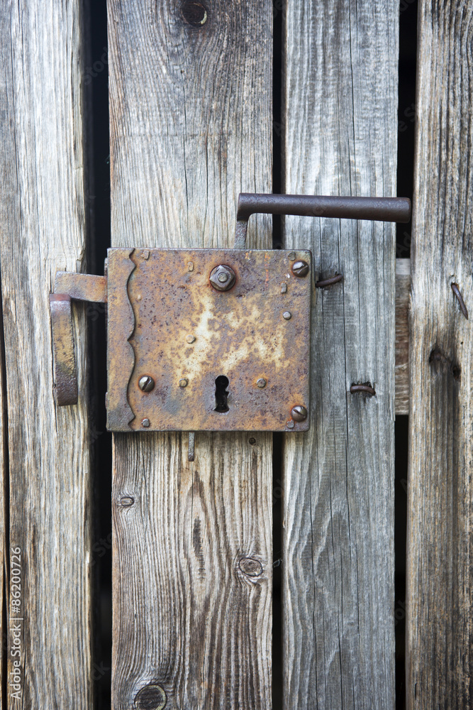 old wooden entrance door with antique door handle old wooden entrance door with antique door handle