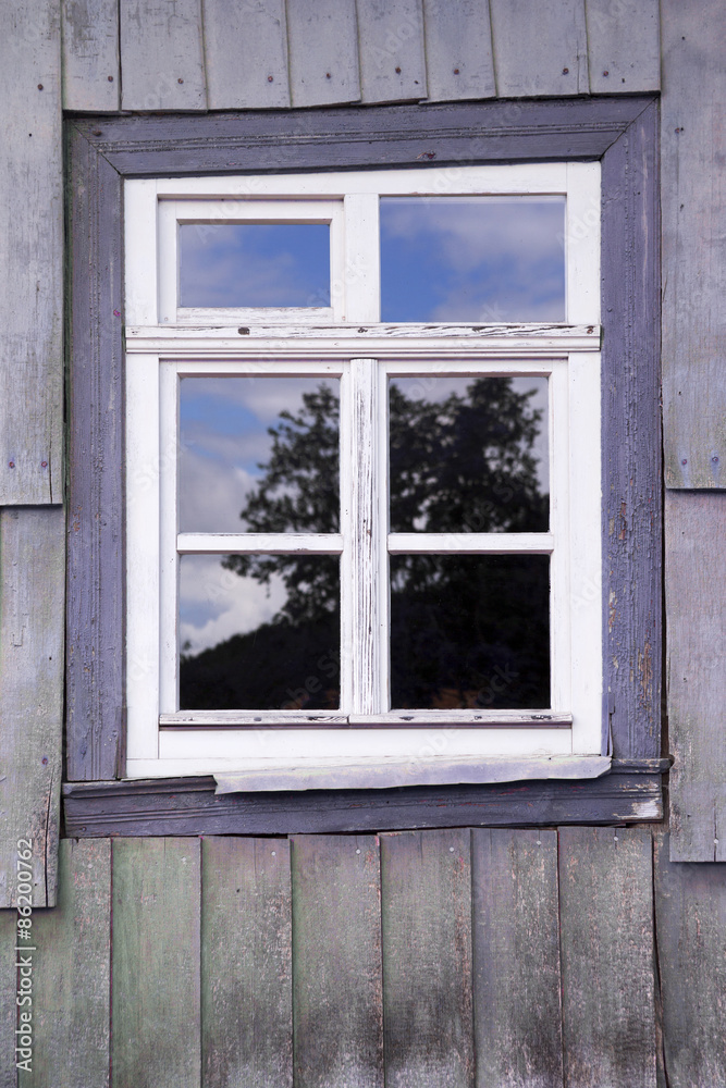 Fototapeta premium window of an old wooden house