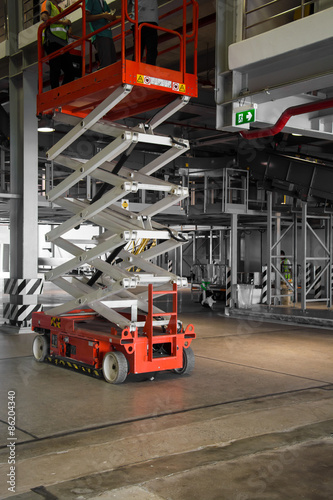 warehouse hall with hydraulic scissors lift