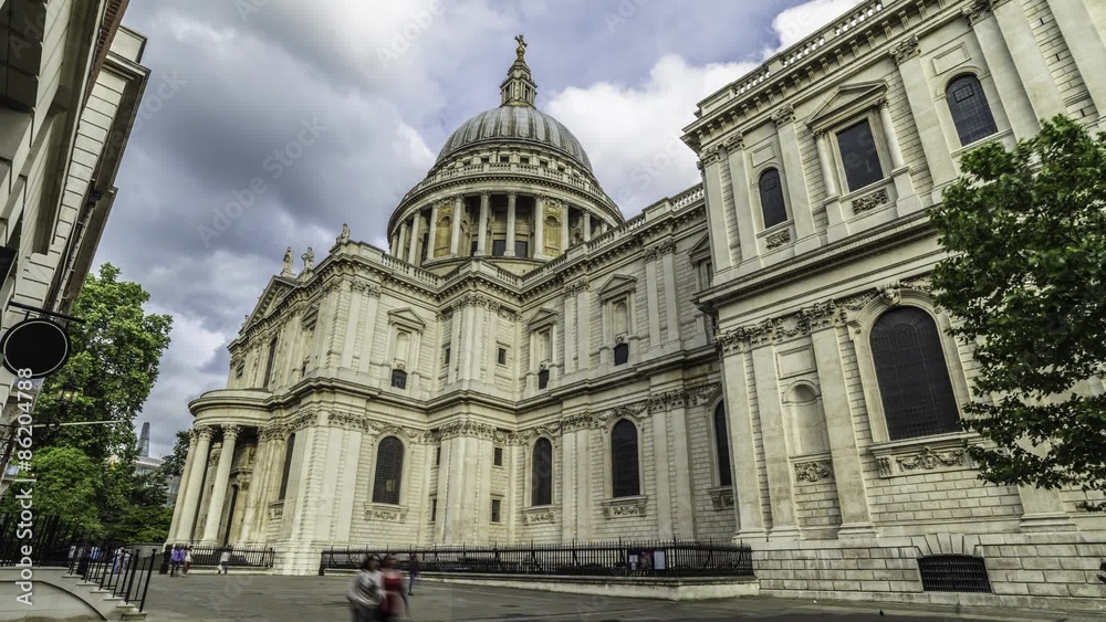 Time lapse close up view of the north facade and the dome of St Paul cathedral in London with clouds and traffic Time lapse close up view of the north facade and the dome of St Paul cathedral in London with clouds and traffic