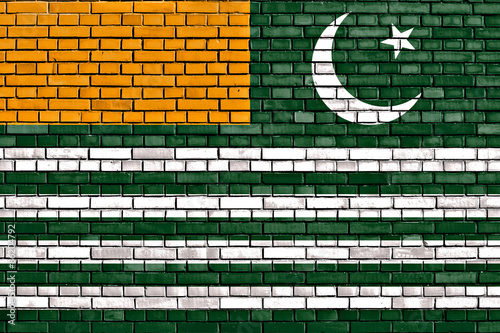 flag of Azad Kashmir painted on brick wall photo