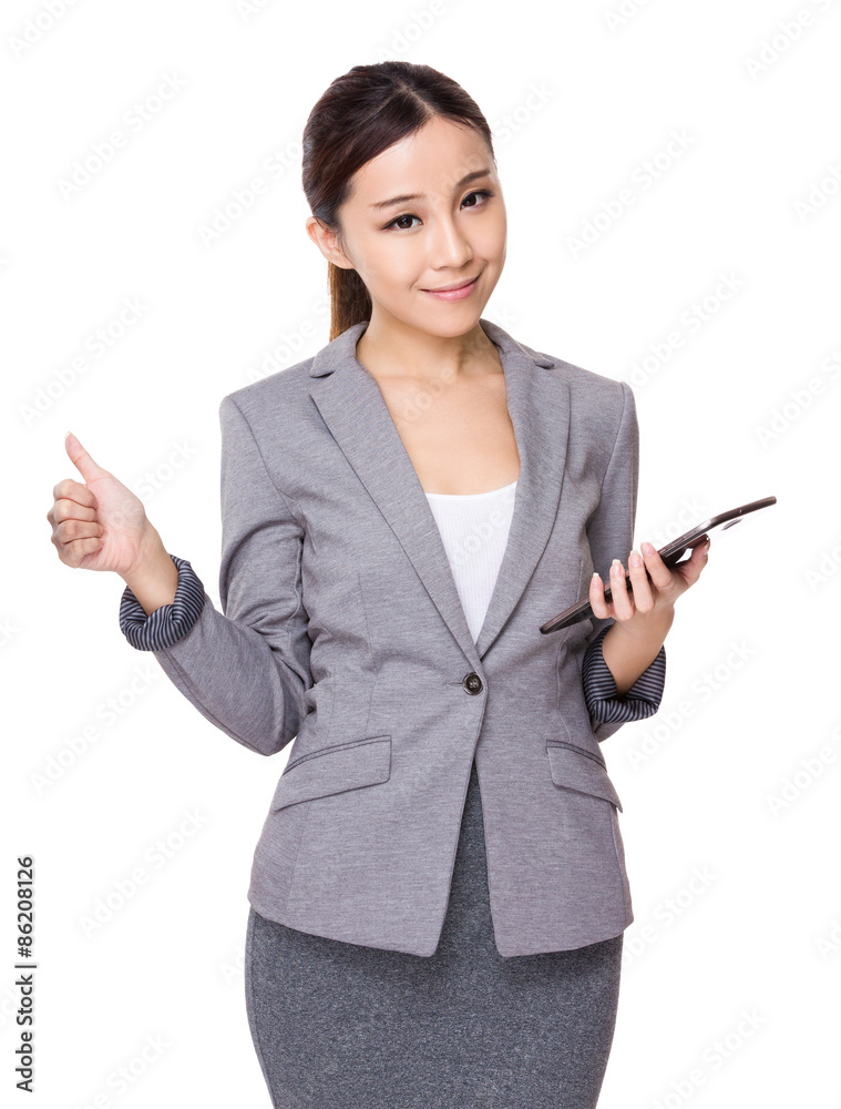 Businesswoman use of the tablet and thumb up Businesswoman use of the tablet and thumb up