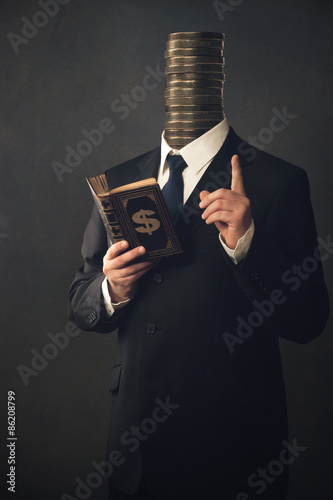Fotografía Businessman with moral pointing finger and handbook for making m