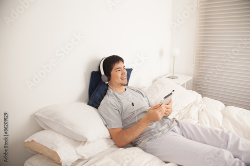 Man listening to music with the tablet