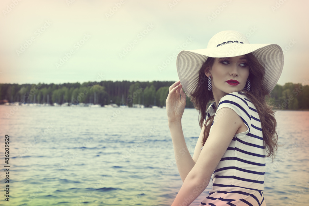 pretty girl in a commercial shot outside near sea color vintage