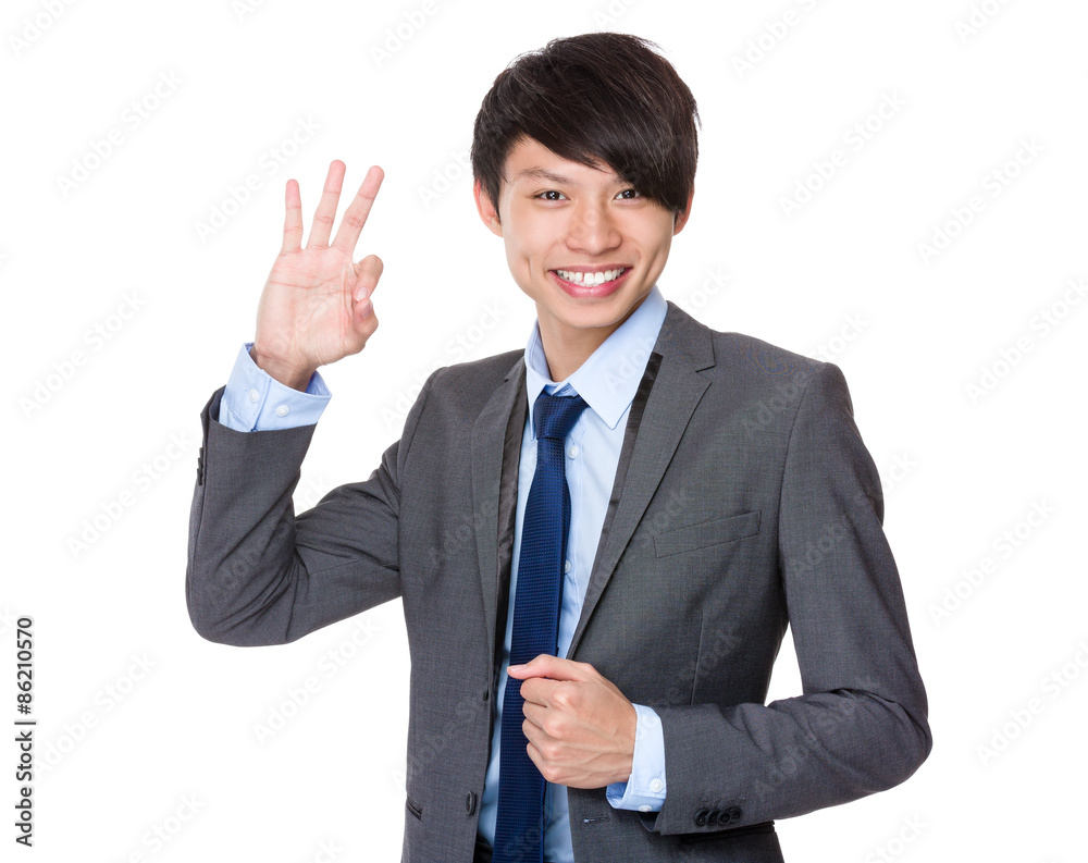 Young businessman with ok sign gesture Young businessman with ok sign gesture