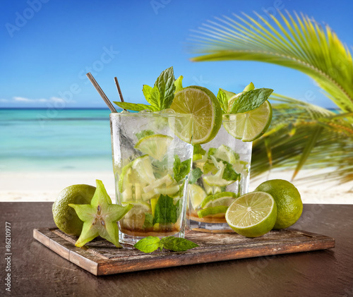 Summer drinks with blur beach on background