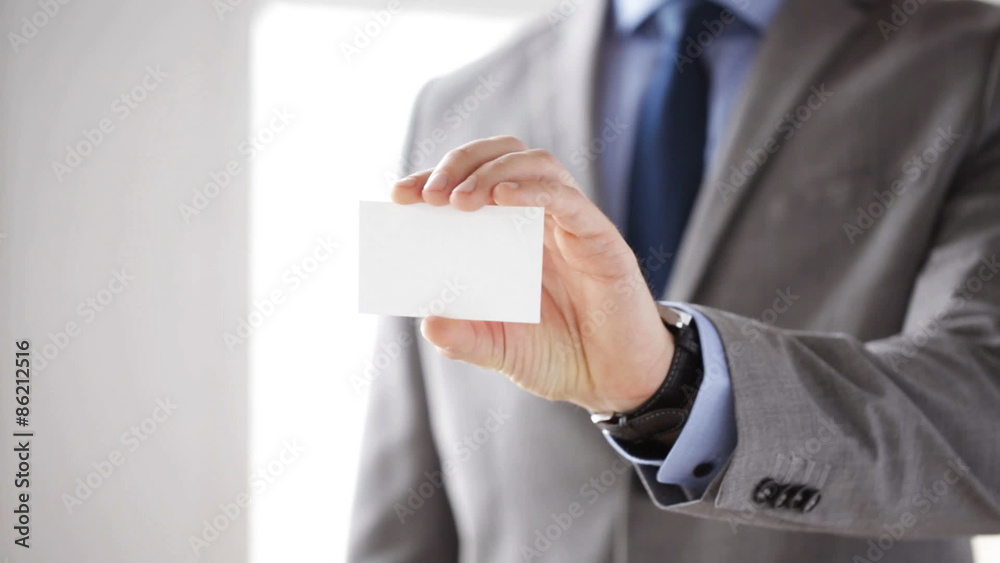 close up of businessman showing white blank card