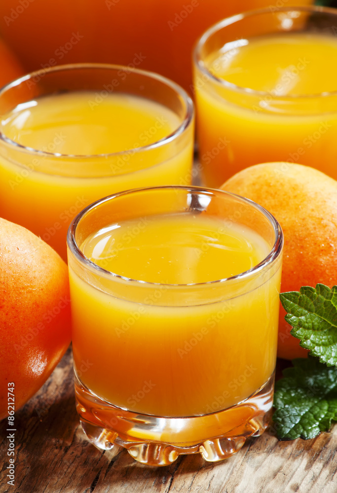 Fresh apricot juice and apricots with mint on old wooden table, Fresh apricot juice and apricots with mint on old wooden table,