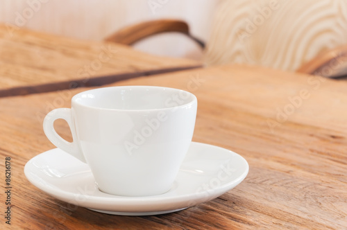White coffee cup on wood table