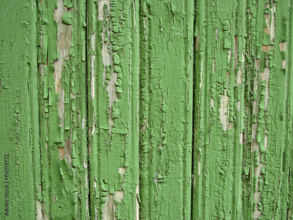 Green peeling wooden wall as a background Green peeling wooden wall as a background