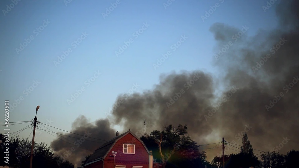 Fire burning and black smoke over the house. Fire burning and black smoke over the house.