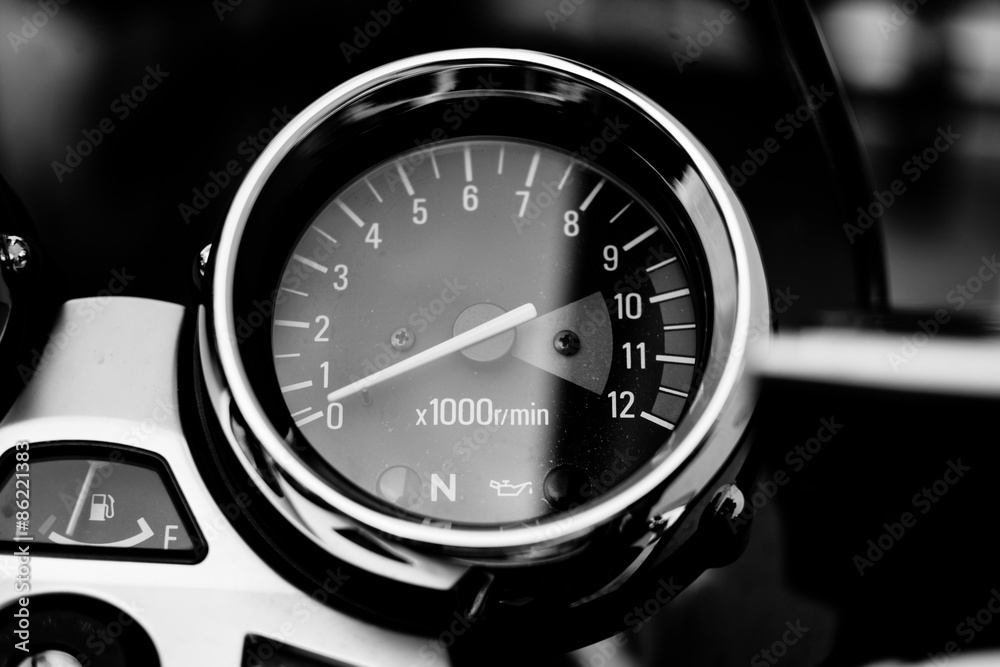 Tachometer on motorcycle. Close up, photographed in black and white. Red line beggins at 9500rpm