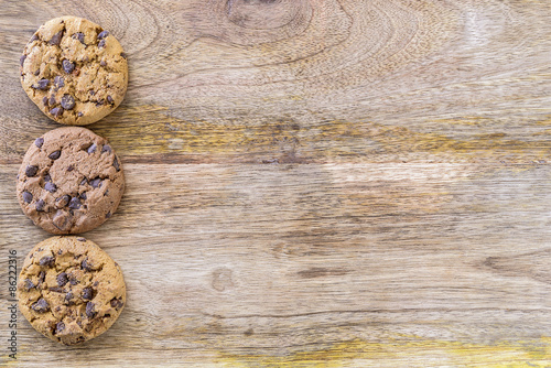 three american cookies on wooden table