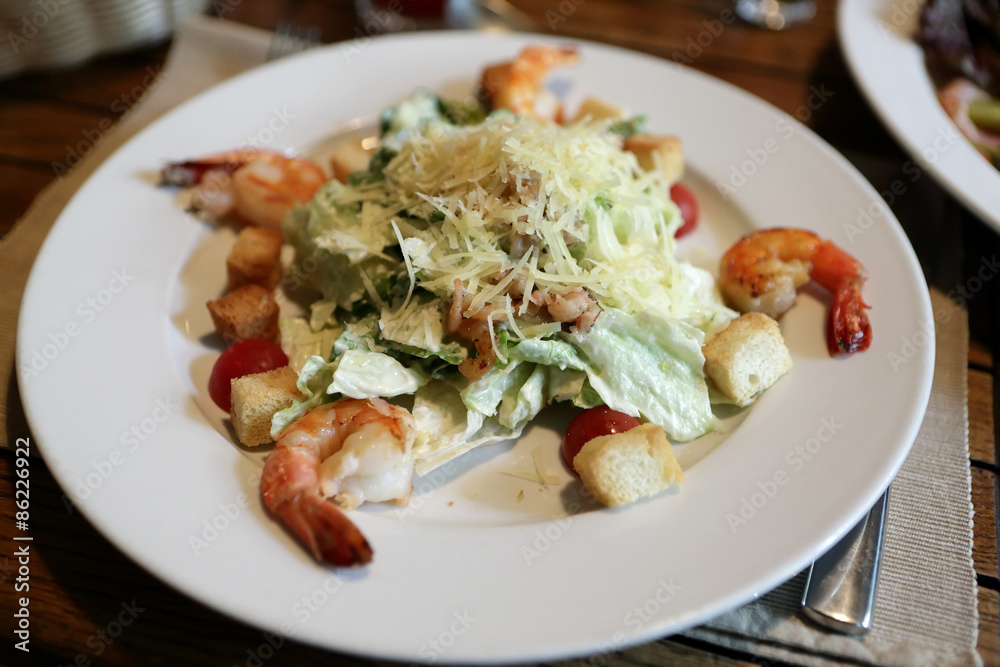 Plate with caesar salad Plate with caesar salad
