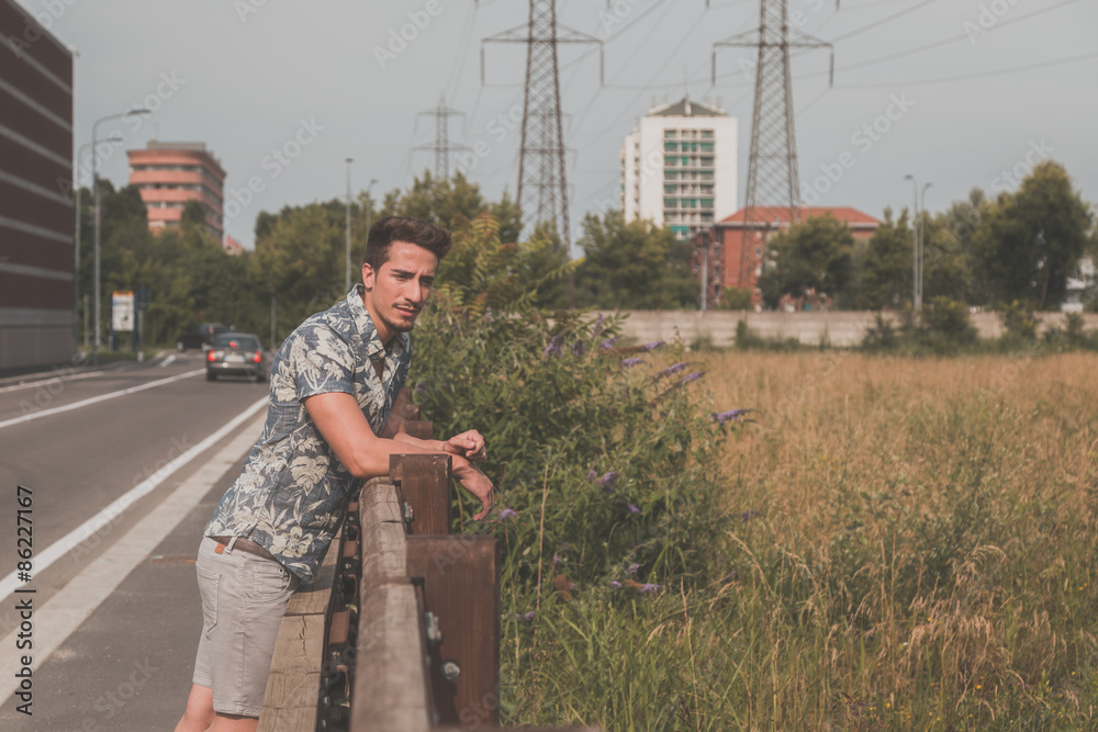 Fototapeta premium Young handsome man posing in the street