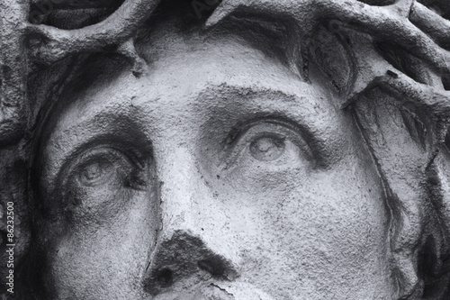Photography crucified Jesus Christ, eyes (statue fragment)