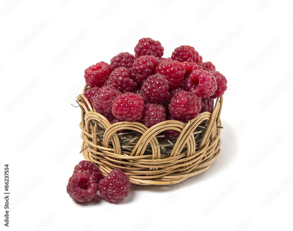 Raspberry in a wicker basket. Isolated on white background Raspberry in a wicker basket. Isolated on white background